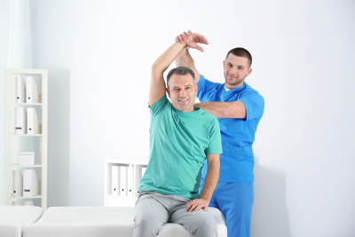 caregiver conducting physical therapy